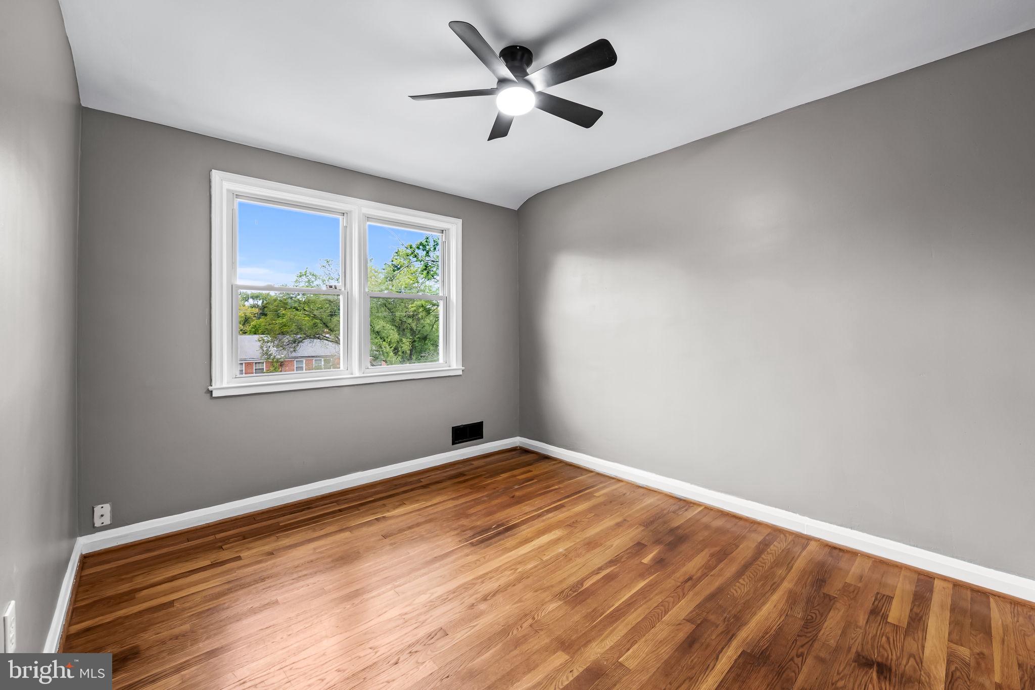 6216 Falkirk Road Baltimore, MD 21239 - Photo 19 of 27 a view of an empty room with a window