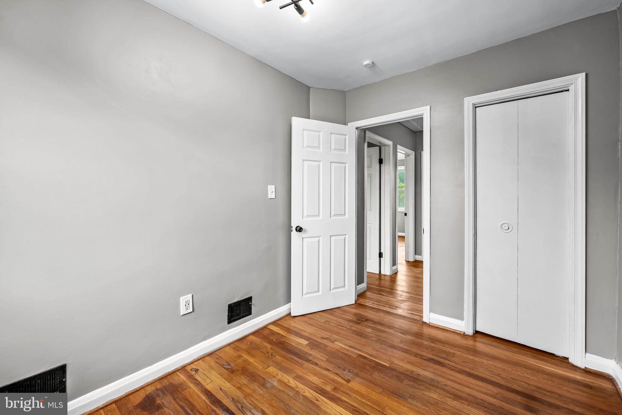 6216 Falkirk Road Baltimore, MD 21239 - Photo 20 of 27 a view of empty room with wooden floor