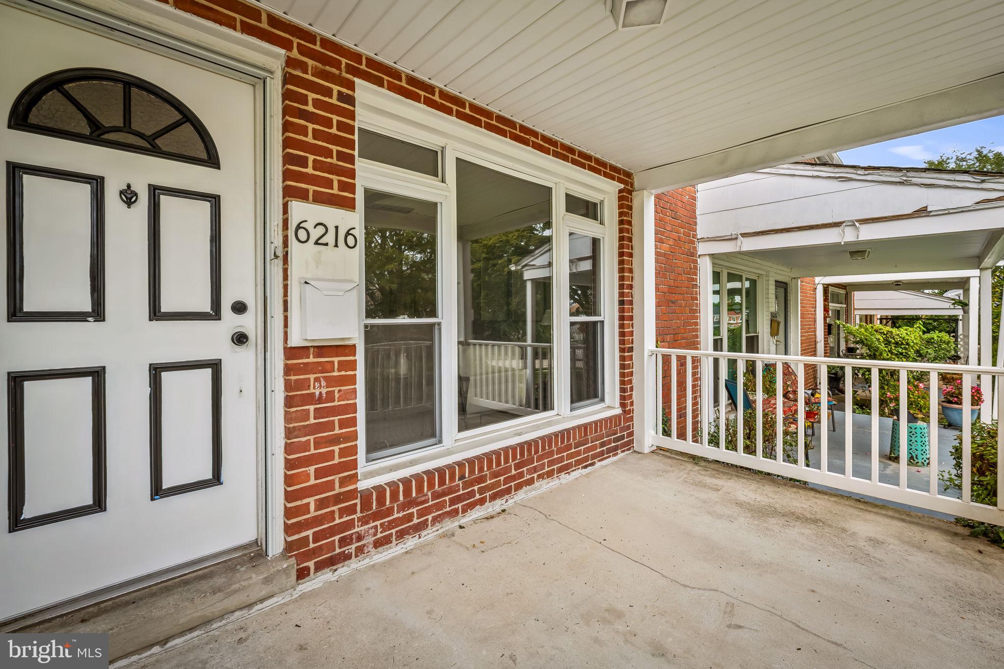 6216 Falkirk Road Baltimore, MD 21239 - Photo 2 of 27 a view of a brick house with large windows