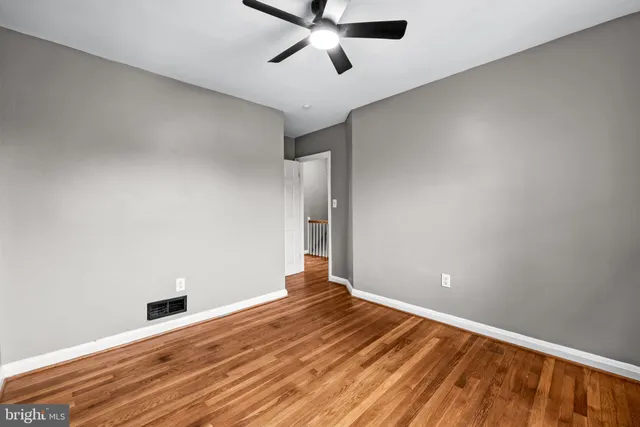 a view of room with wooden floor