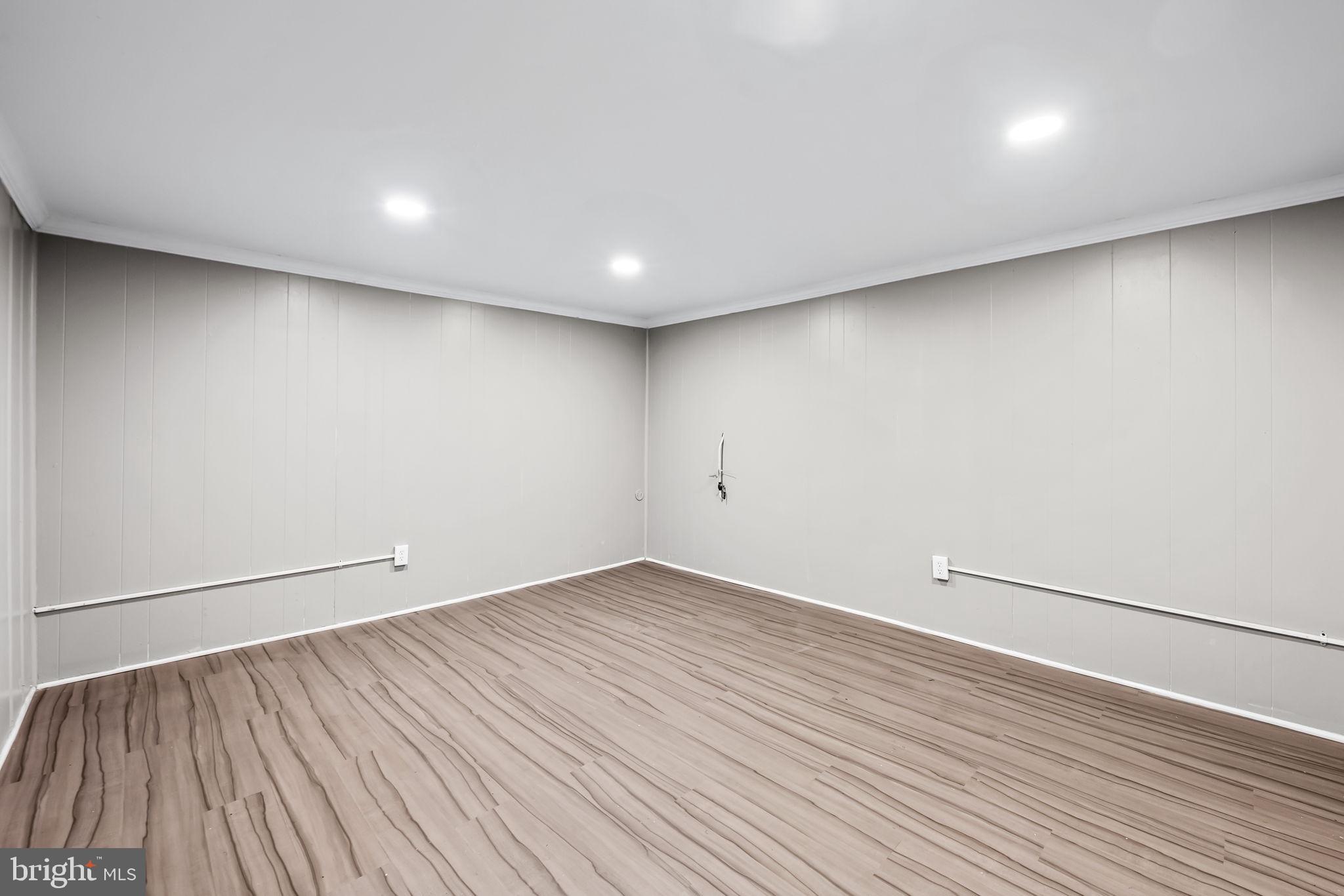 6216 Falkirk Road Baltimore, MD 21239 - Photo 23 of 27 a view of room with wooden floor