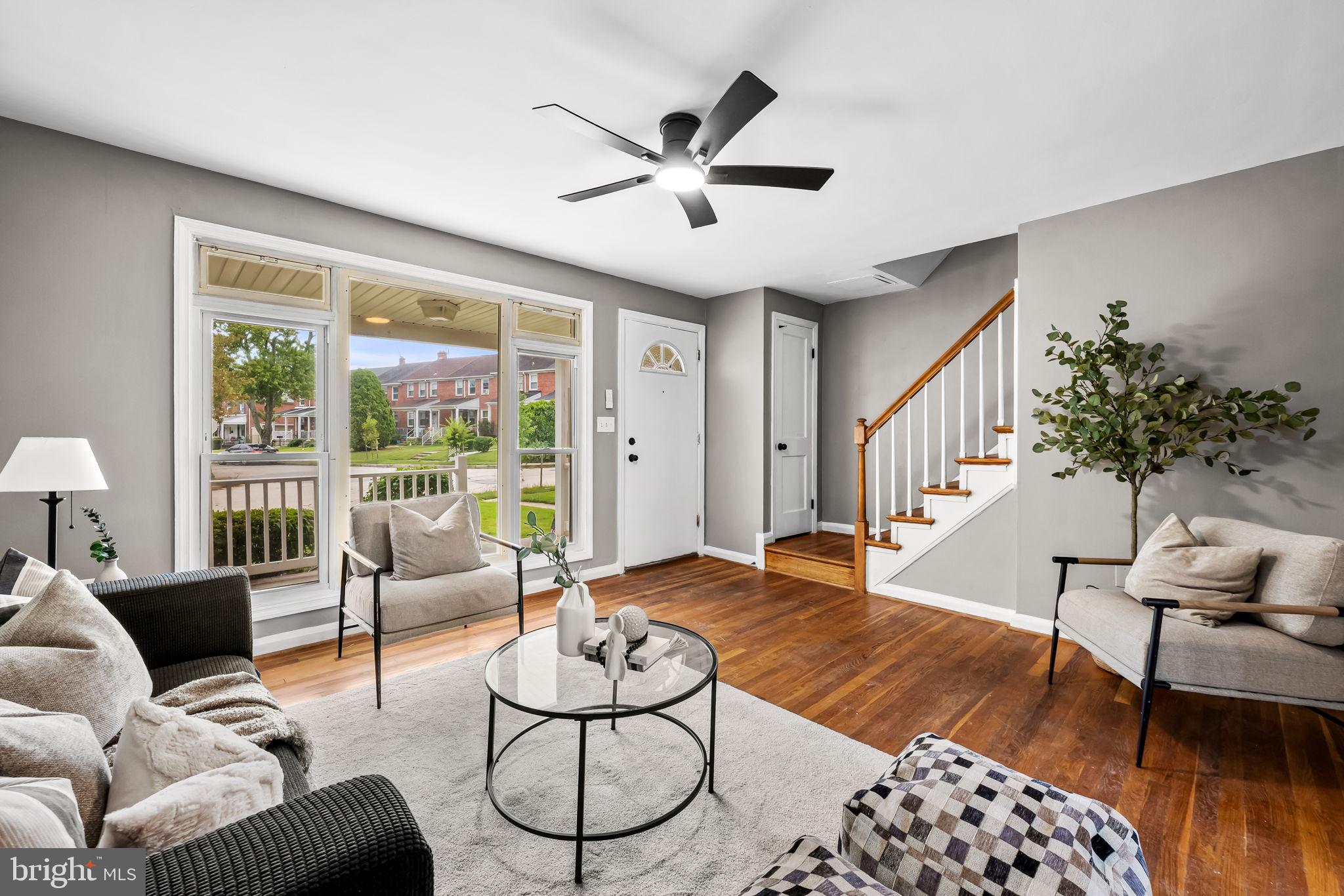 6216 Falkirk Road Baltimore, MD 21239 - Photo 4 of 27 a living room with furniture and a large window