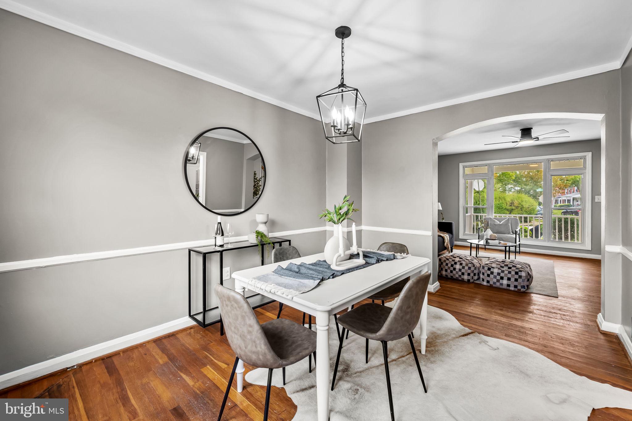 6216 Falkirk Road Baltimore, MD 21239 - Photo 8 of 27 a view of a dining room with furniture window and wooden floor