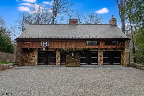 a view of a house with a yard and garage