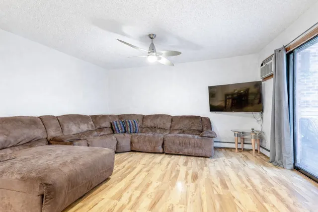 a living room with a couch and a flat screen tv