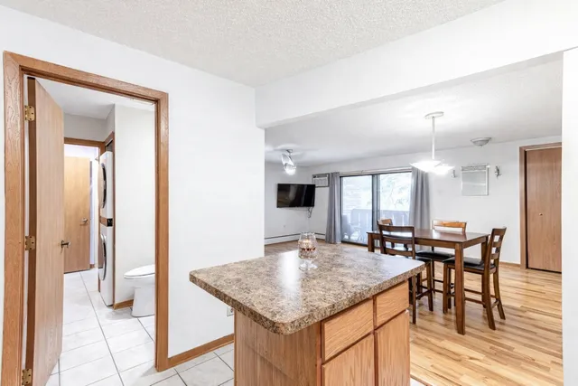 a kitchen with a table and chairs in it