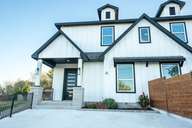 a front view of a house with garage