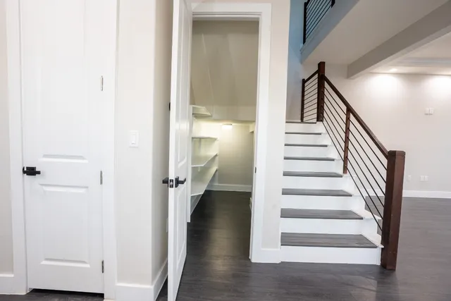 a view of entryway with wooden floor and staircase