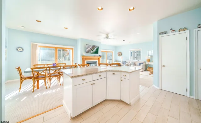 a kitchen with a sink appliances and cabinets