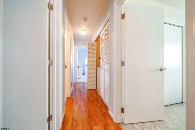 a view of a bathroom from a hallway