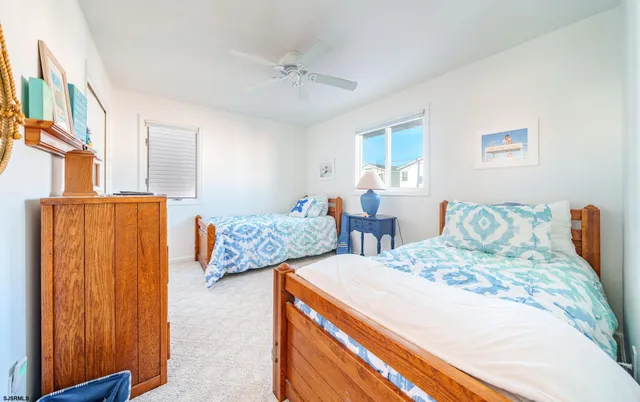 a bedroom with double bed and a large window