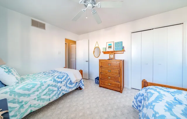 a bedroom with a bed and a cabinets