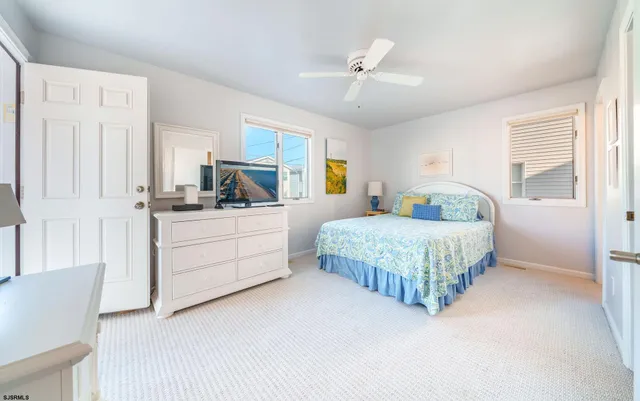 a bedroom with a bed bathroom and window