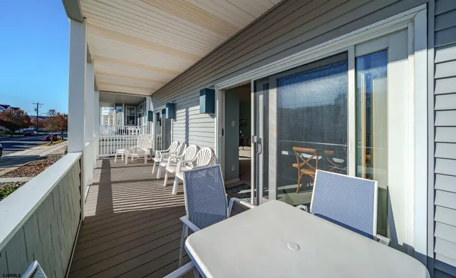 a view of living room kitchen and patio
