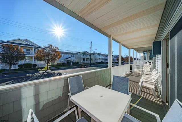 a view of a patio with table and chairs