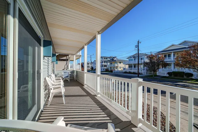a view of a balcony with wooden floor