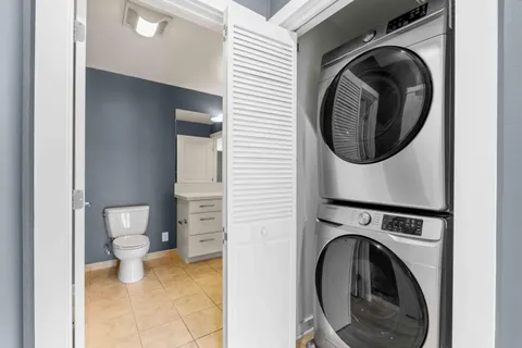 a view of a hallway with washer and dryer