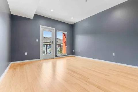 a view of an empty room and window