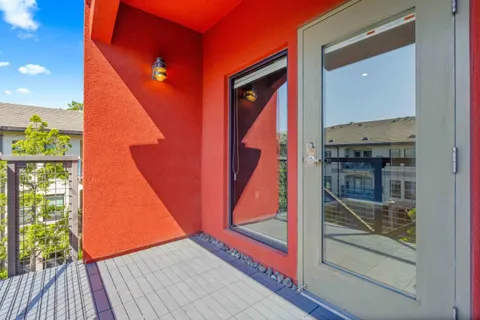 a view of a balcony with wooden floor