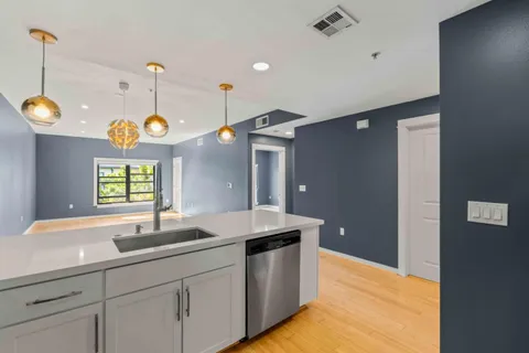 a bathroom with a sink and a large mirror