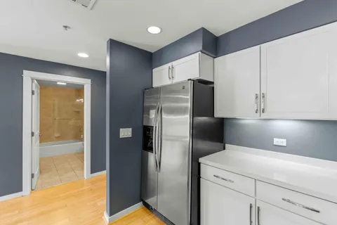 a kitchen with stainless steel appliances a refrigerator and a sink