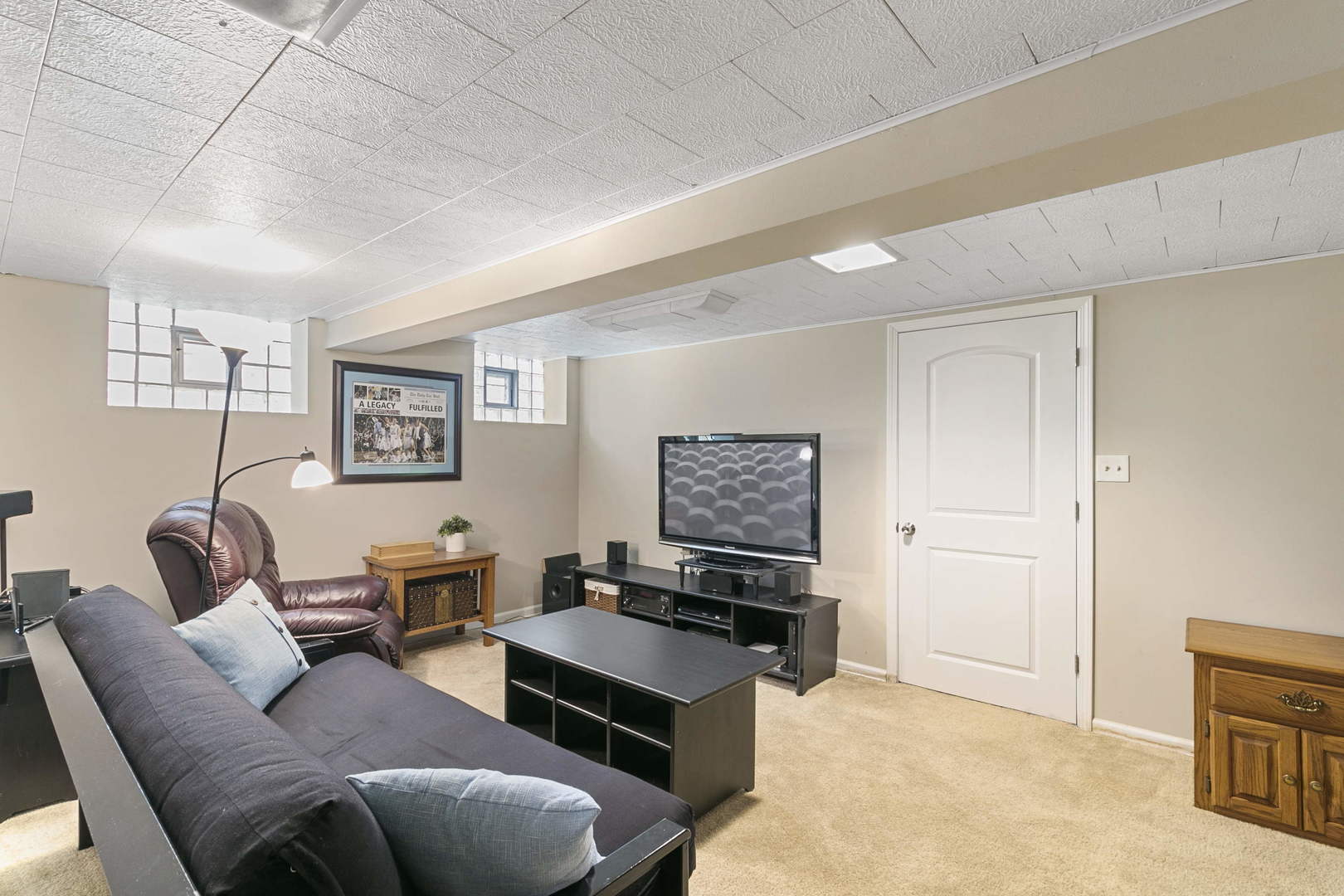 445 Uvedale Road Riverside, IL 60546 - Photo 12 of 26 a living room with furniture and a flat screen tv