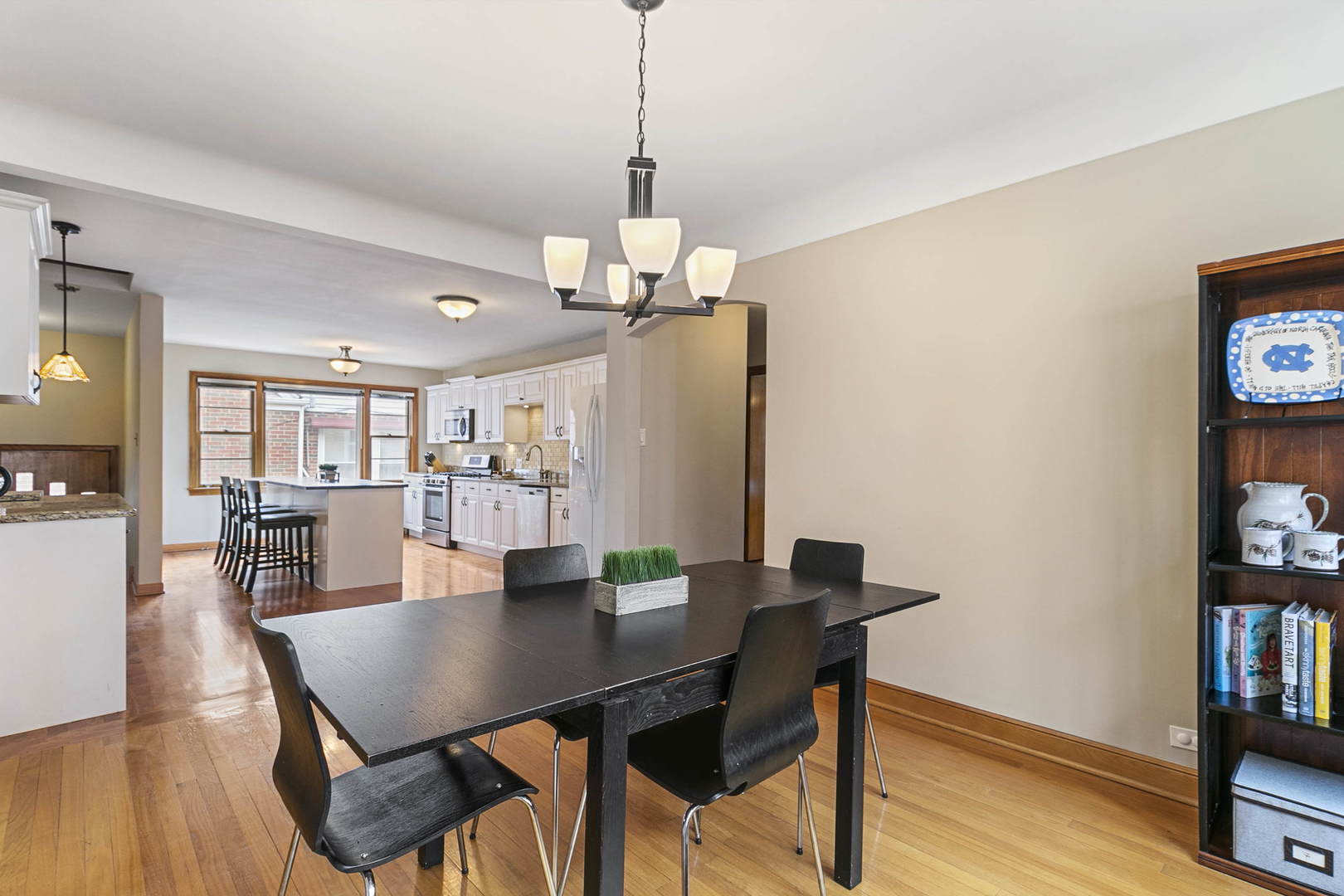 445 Uvedale Road Riverside, IL 60546 - Photo 6 of 26 a view of a dining room with furniture and wooden floor
