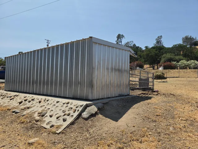 a view of a backyard of a house