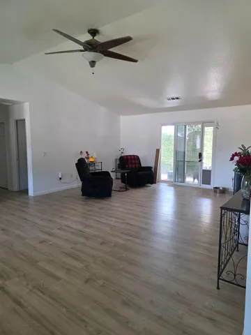 a bed room with a bed and a tv