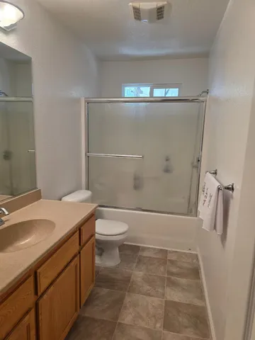 a patio with table and chairs