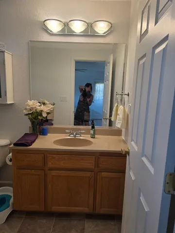 a bedroom with a bed and a closet