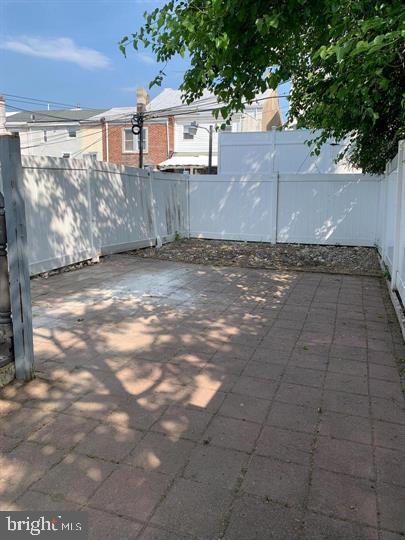 120 Grape Street Philadelphia, PA 19127 - Photo 23 of 24 a view of a yard with brick wall
