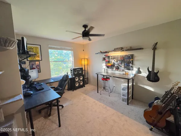a view of a workspace with furniture and a livingroom