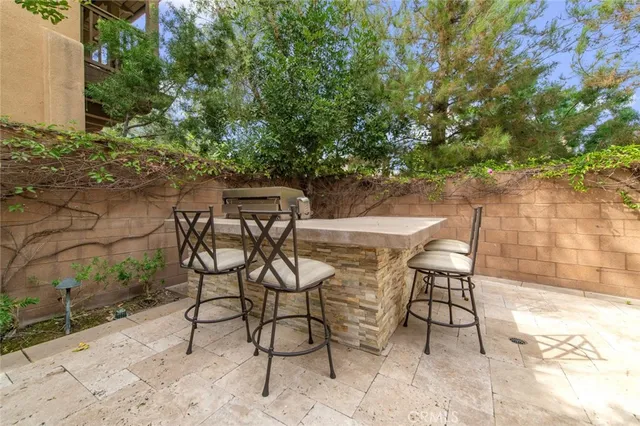 a view of a chairs and table in the patio