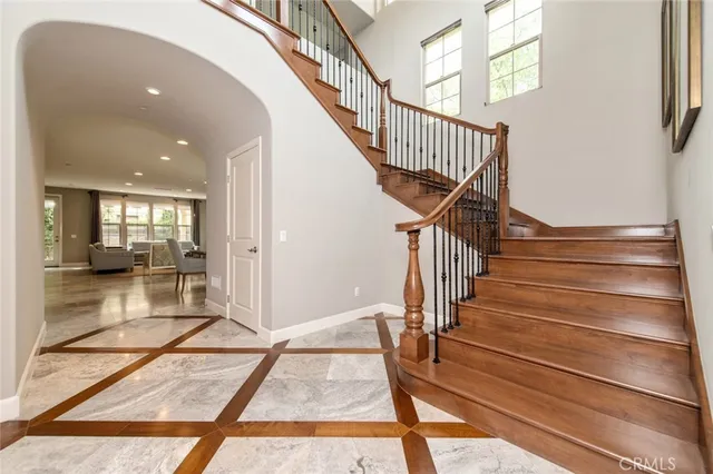 a view of entryway and hall with wooden floor