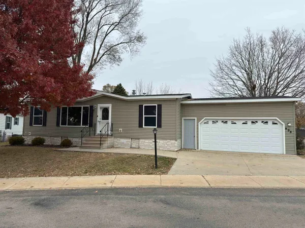 a front view of a house with yard