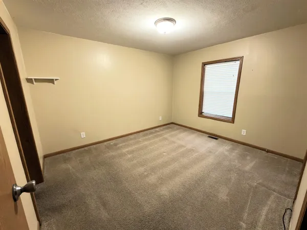 an empty room with a door