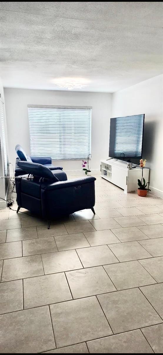 13208 Southwest 10th Lane Miami, FL 33184 - Photo 3 of 10 a room with furniture and a window