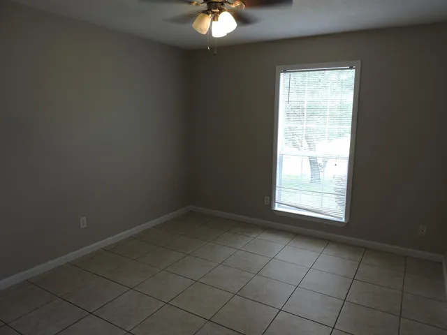 a view of an empty room with a bathroom