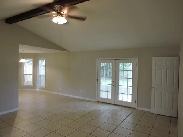 a view of an empty room with a window
