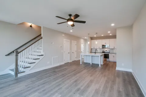 a view of kitchen with table and chairs