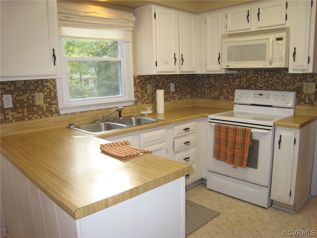 4512 Rabbit Foot Lane North Chesterfield, VA 23236 - Photo 17 of 46 U shaped functional kitchen, replaced double hung