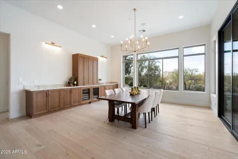 a view of a dining room with furniture window and outside view