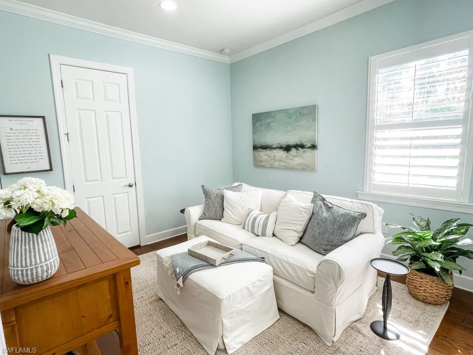 16163 Cartwright Lane Naples, FL 34110 - Photo 20 of 35 a living room with furniture and wooden floor