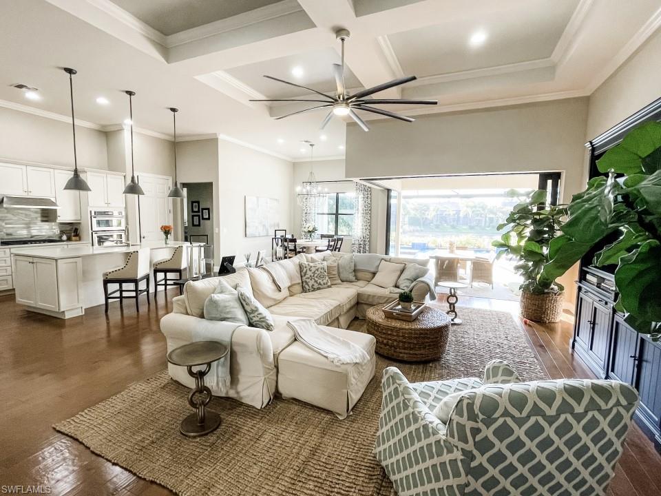 16163 Cartwright Lane Naples, FL 34110 - Photo 8 of 35 a living room with furniture and a large window