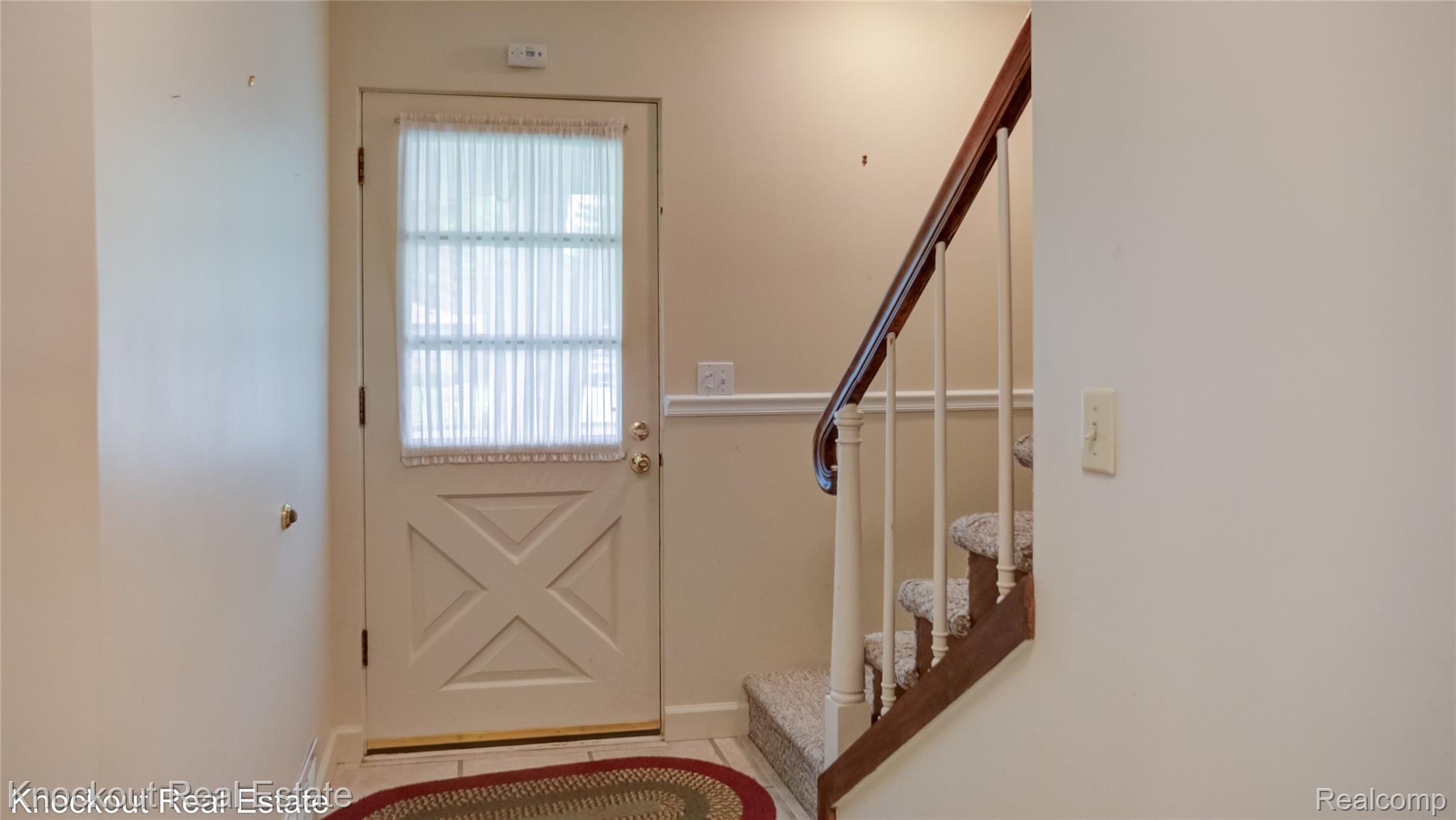 4465 Dirker Road Saginaw, MI 48638 - Photo 5 of 56 Doorway to outside featuring stairway