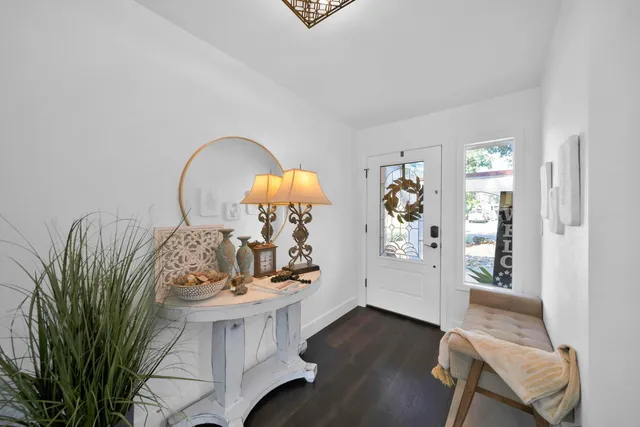 a view of living room with furniture and wooden floor