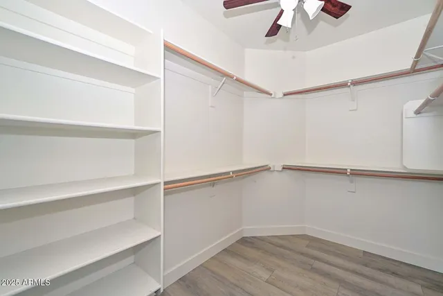 a view of an empty walk in closet