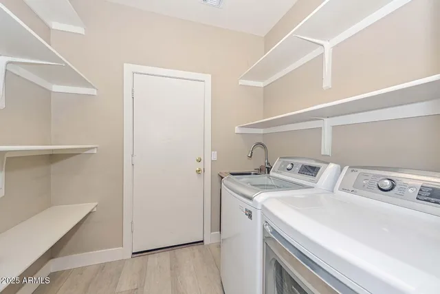 a utility room with dryer and washer