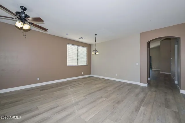 a view of room with window and hardwood floor
